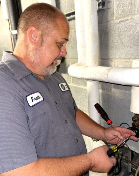 Frank Stafford making a repair at the Alexander County Detention Center.