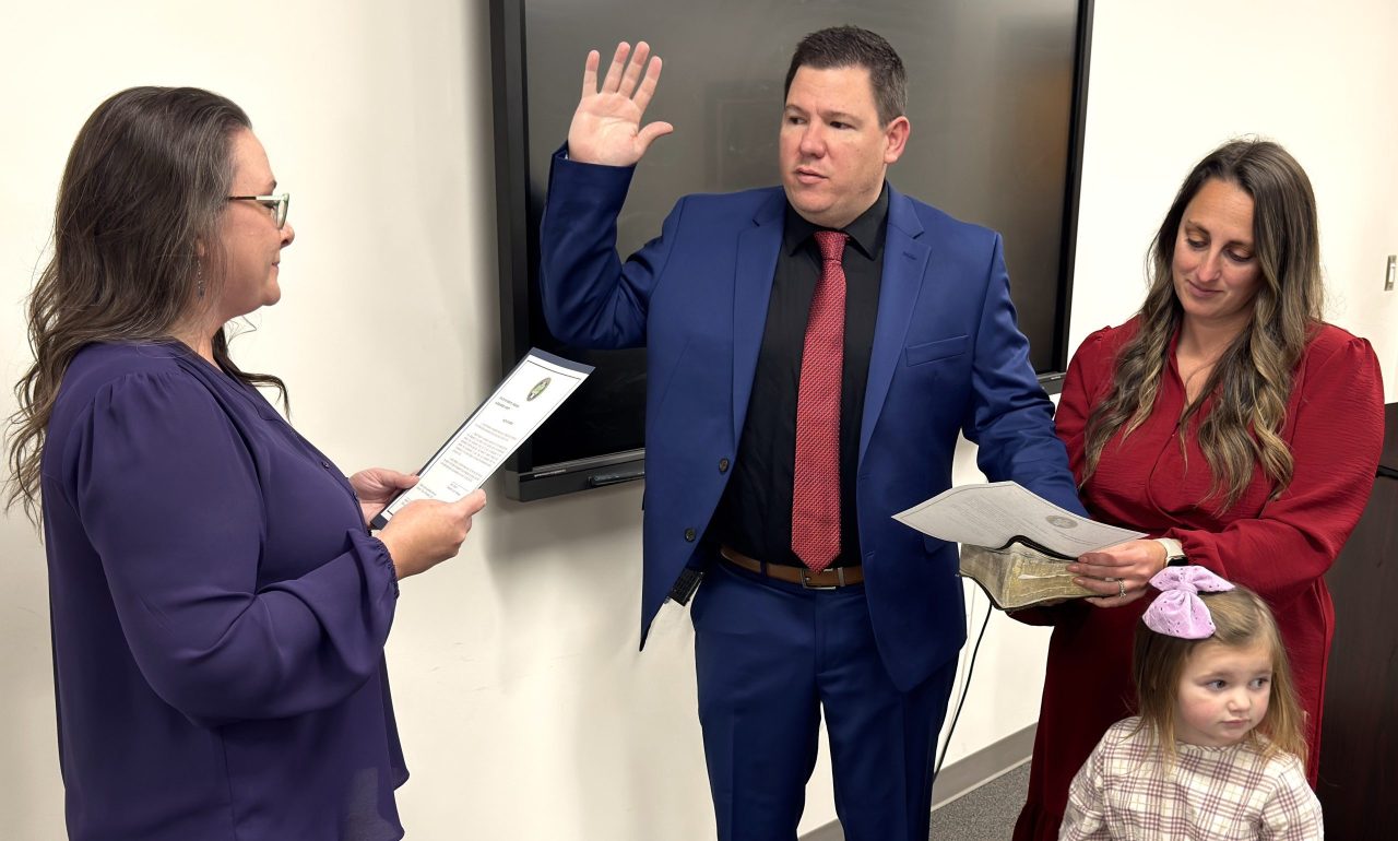 New County Manager Justin Mundy takes the oath of office on December 1, 2025.