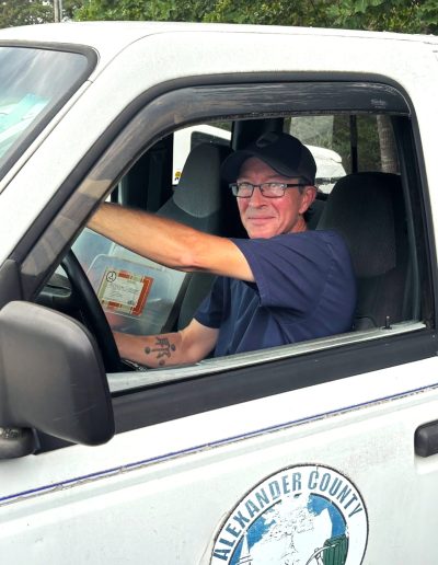 Josh Phelps behind the wheel of a work truck.